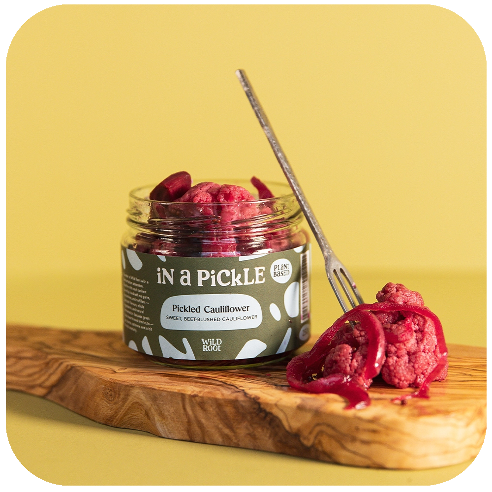 Pickled Pink Cauliflower jar opened with a fork on the side 