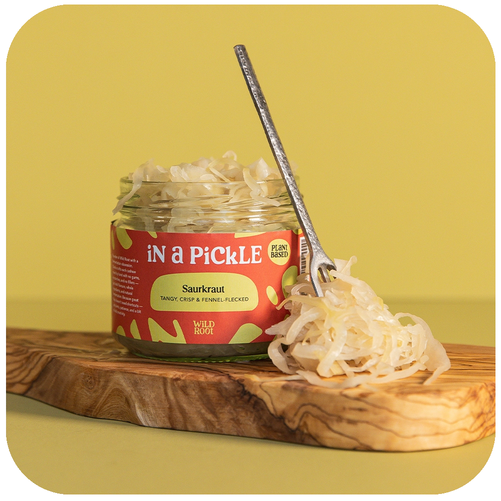 Sauerkraut jar opened with a spoon on the side 