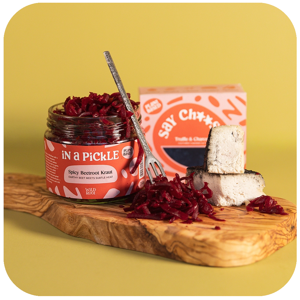 Truffle & Charcoal Cheese and Spicy Beetroot Kraut on a serving board 