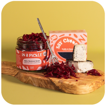 Truffle & Charcoal Cheese and Spicy Beetroot Kraut on a serving board 