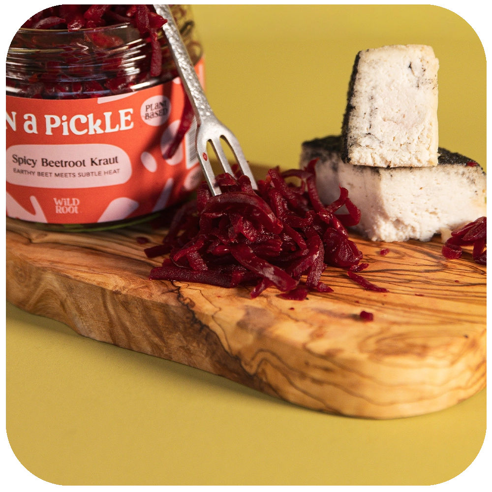 Truffle & Charcoal Cheese and Spicy Beetroot Kraut on a serving board 