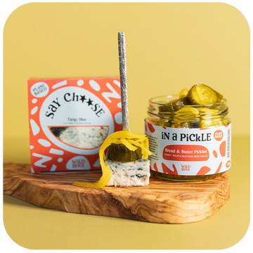 Perfect Pairings: Tangy Blue Cheese and Bread and Butter Pickles on a serving board 