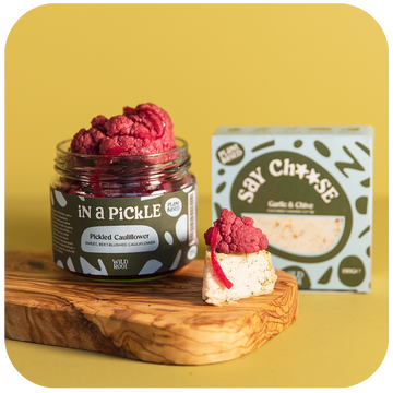 Garlic & Chive Cheese and Pickled Pink Cauliflower on the serving board 